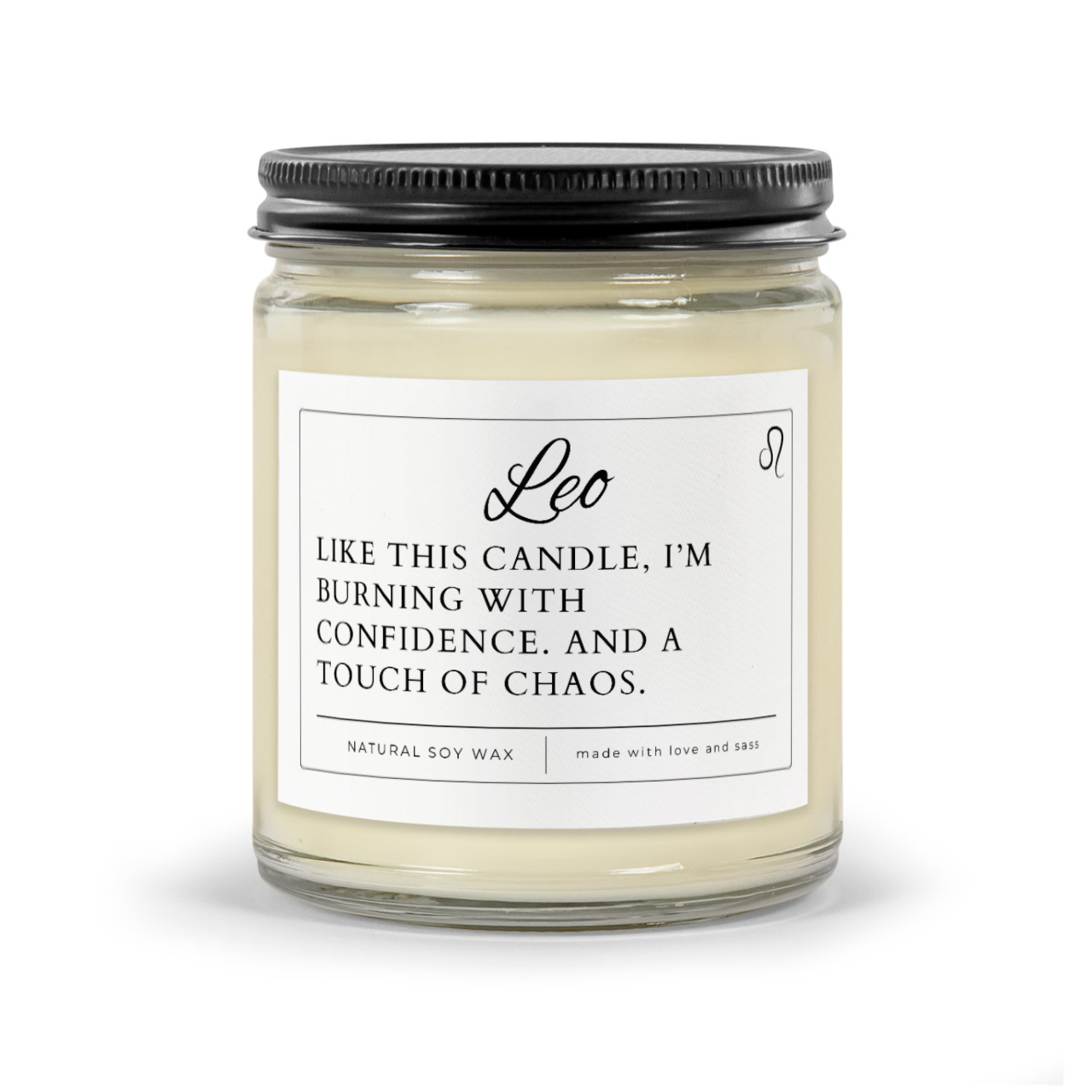 Leo Zodiac Candle Funny - White wax 9oz candle in clear jar with black matte lid. Label says "Like this candle, I'm burning with confidence. And a touch of chaos.